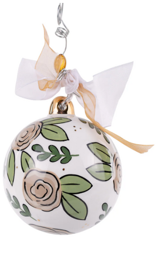 Decorative ornament with floral design and bow on a white background