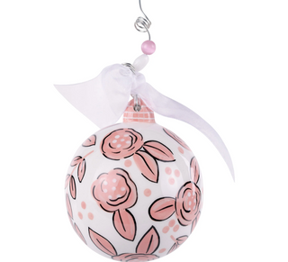 Decorative ornament with pink floral pattern on a white background