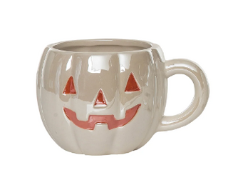 A glossy ceramic mug shaped like a jack-o'-lantern pumpkin, featuring a carved face with red accents on a white background.