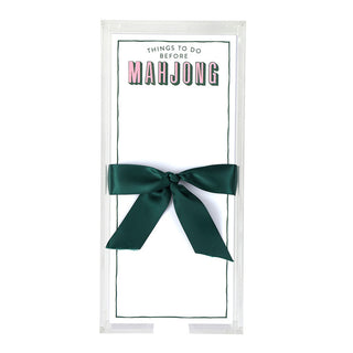 Notepad with a green ribbon on a white background