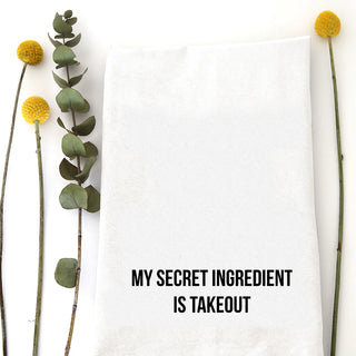 Floral arrangement with text 'My secret ingredient is takeout' on a white background