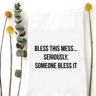 Floral arrangement with text 'Bless this mess... Seriously, someone bless it' on a white background