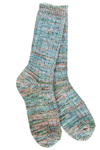 A pair of hand-knit socks featuring a marled, heathered pattern of blue, green, pink, and beige yarn, displayed against a solid white background.