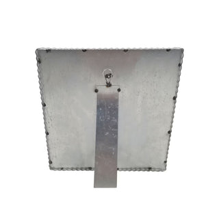 Metallic square with a rectangular cutout and a clip on a white background
