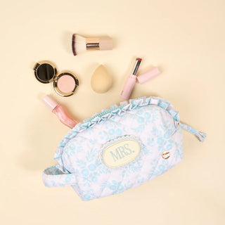 Makeup bag with 'MRS.' on a beige background