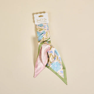 Floral headband with packaging on a beige background