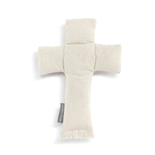 Cross-shaped fabric item with a tag on a white background
