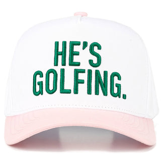 Cap with 'HE'S GOLFING.' text on a white background
