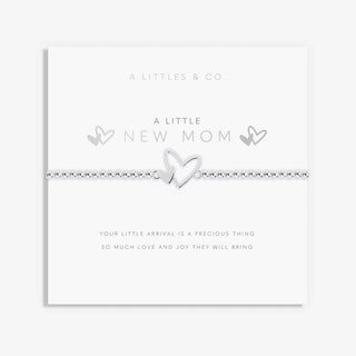 Silver bracelet with heart design on a white card with text, featuring 'A Littles & Co' branding.