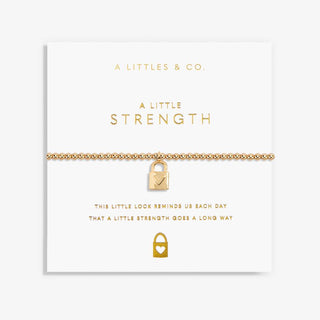 Gold bracelet with lock charm on a white card with 'A Littles & Co' branding.