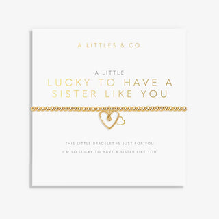 Gold bracelet with heart design on a white card with text, featuring 'A Littles & Co' branding.