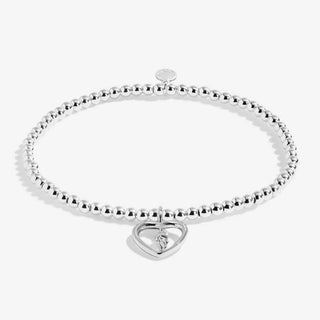 Silver bracelet with a heart-shaped clasp on a white background