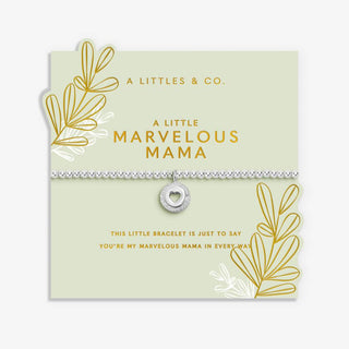 Silver bracelet with heart charm on a 'A Littles & Co.' card with decorative elements