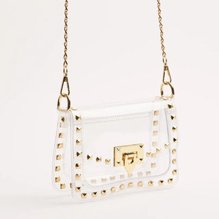 White handbag with gold studs and a gold clasp on a light gray background