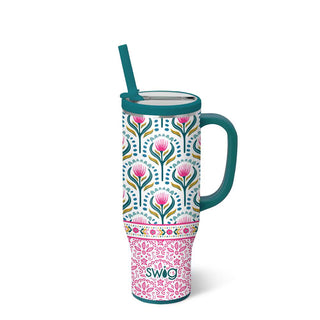Floral-patterned tumbler with a handle on a white background
