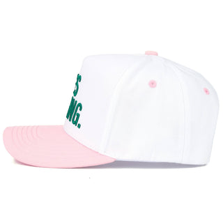 White cap with pink brim and green text on a white background