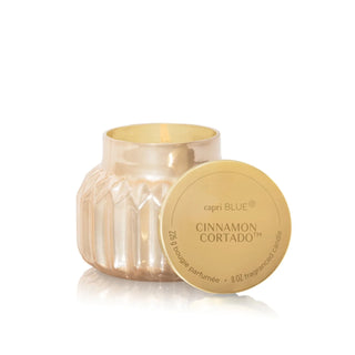 Capri Blue cinnamon cortado candle with lid on a white background