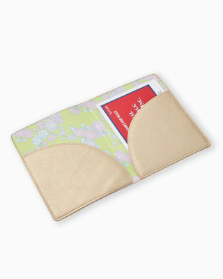 Floral-patterned cardholder with beige accents on a white background