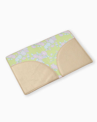 Floral-patterned mat with beige border on a white background
