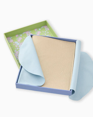 Roll of beige paper with a blue cover in a green box on a white background
