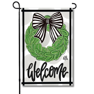 Decorative banner with green wreath, black bow, and 'Welcome' text on a white background.