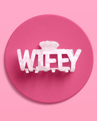 Clear hair clip with 'WIFEY' text on a pink background