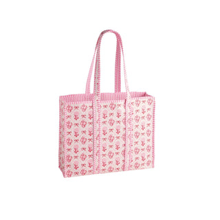A pink and white patterned reusable tote bag with two shoulder straps, shown on a plain white background.
