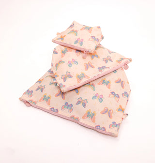 A three-piece baby blanket set in a soft pink fabric with a colorful butterfly print, featuring a large square blanket, a medium triangular blanket, and a small square pouch, all arranged on a plain white background.