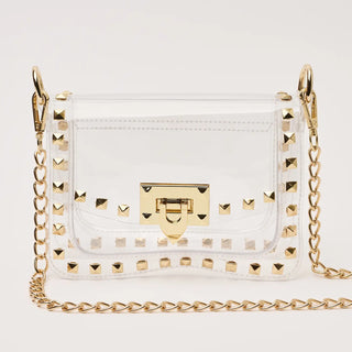 White handbag with gold studs and chain strap on a white background
