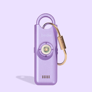 Purple device with gold carabiner on a light purple background
