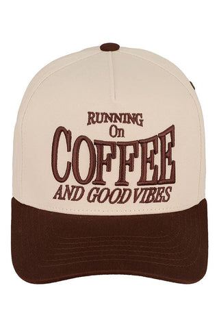 Beige and brown cap with 'Running on Coffee and Good Vibes' text on a white background
