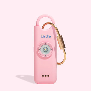 Pink and gold device with 'birdie' branding on a light pink background