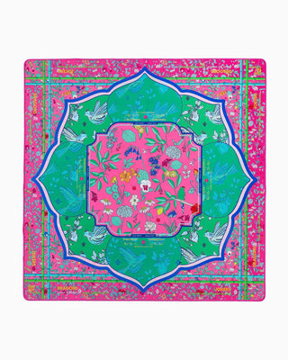 Colorful decorative mat with floral and bird patterns on a pink background