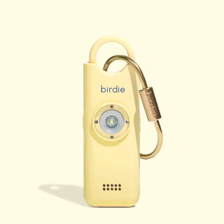 Yellow device with a carabiner on a white background, branded 'birdie'.