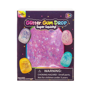 A box of FunWorld Glitter GUM DROP Super Squishy! featuring a purple glittery squishy center with four colorful glittery oval drops in pink, blue, yellow, and purple around it, on a white background.