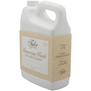 Gallon jug of Tyler Glamorous Wash laundry detergent on a white background
