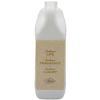 Bottle of Tyler fragrance with a white cap and beige label on a white background