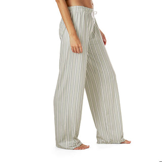 Striped pajama pants worn by a person on a white background