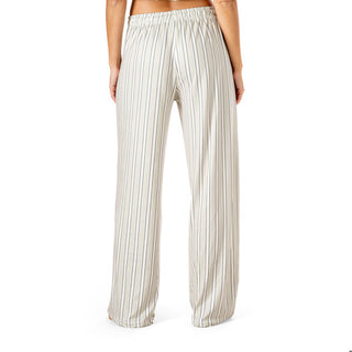 Striped pants worn by a person on a white background