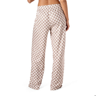 Checkered pants worn by a person on a white background