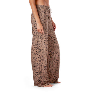 Leopard print pants worn by a person on a white background