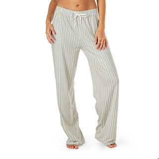 Striped pajama pants worn by a person on a white background