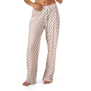 Checkered pajama pants worn by a person on a white background