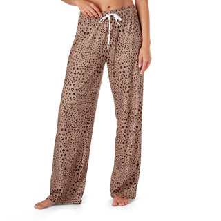 Leopard print pajama pants worn by a person on a white background