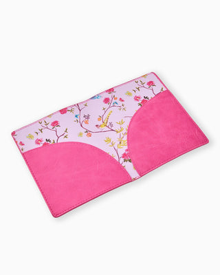 Pink and floral-patterned mat on a white background