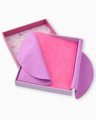 Pink and purple fabric swatches in a box on a white background