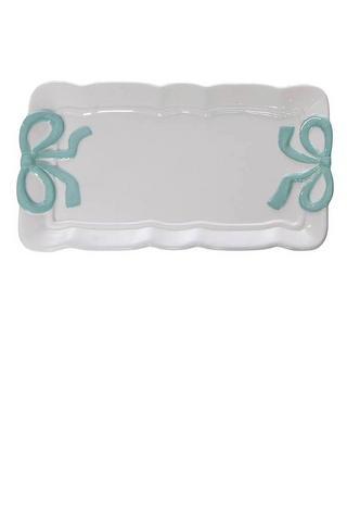 Rectangular white dish with turquoise bows on a white background