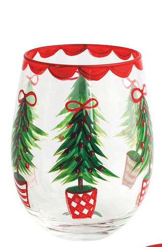 Decorative glass with Christmas tree design on a white background