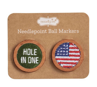 Two needlepoint ball markers on a Mudpie branded card.