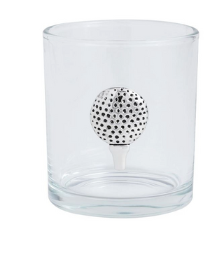 Clear glass tumbler with a black and white polka dot ball on a white background